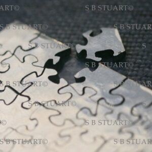 silver small hand cut jigsaw puzzle